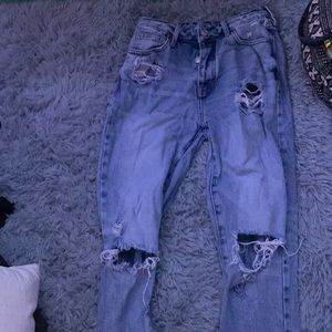 Medium to light wash  ripped mom jeans size 25 fits about a small